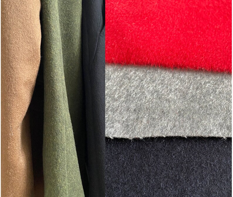 Close-up of pure cashmere fabric swatches including beige, green, black, red, gray, and navy.