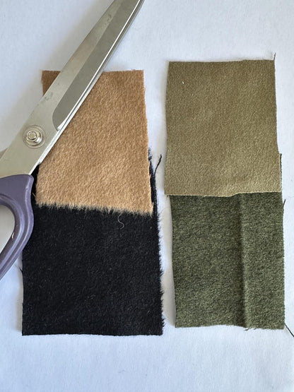 Cashmere fabric color swatches in camel, black, olive and cream.