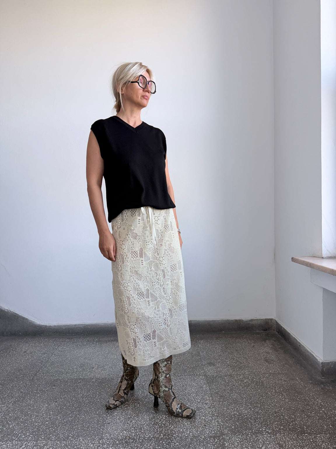 Cream ivory sheer wool skirt styled with black top and boots