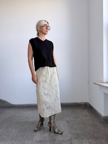 Cream ivory sheer wool skirt styled with black top and boots