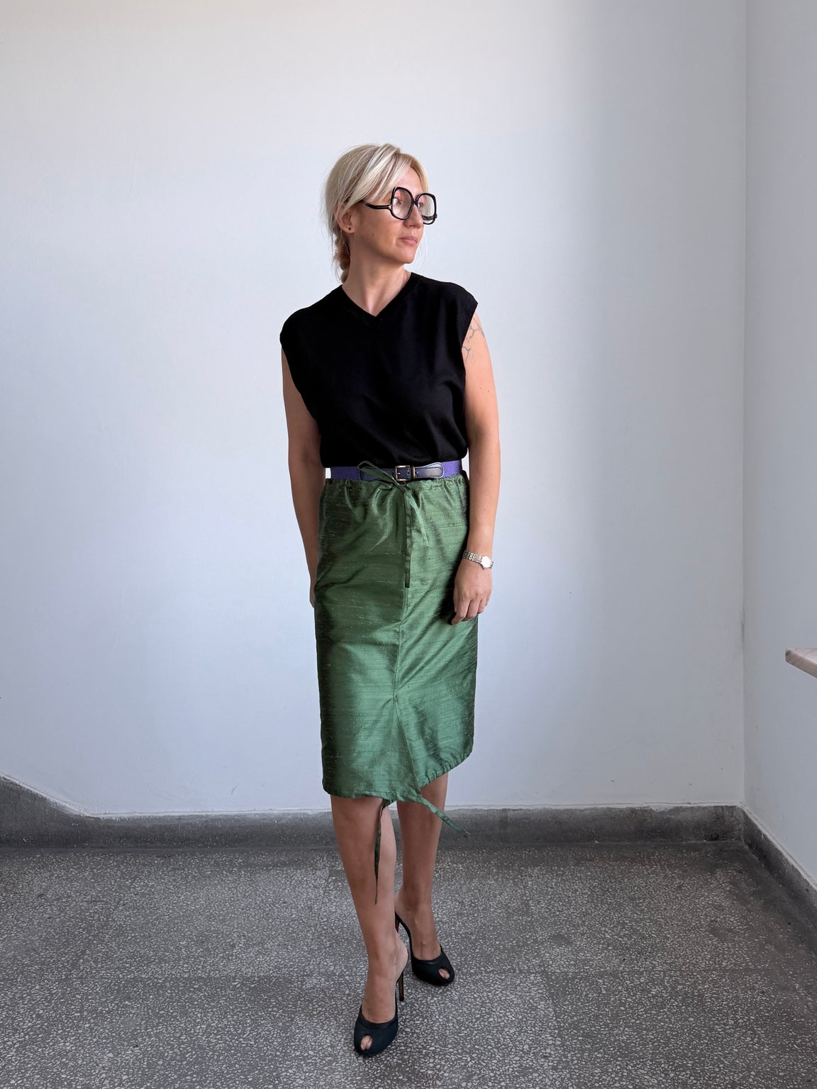 Forest green silk skirt styled with black top and heels