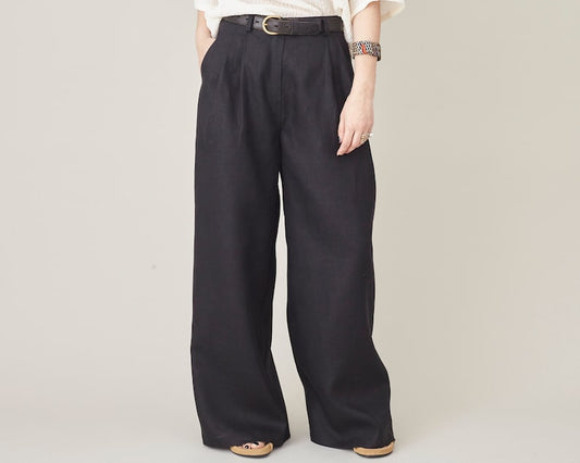 High-waisted black linen wide-leg pants with front pleats by Fine Thee