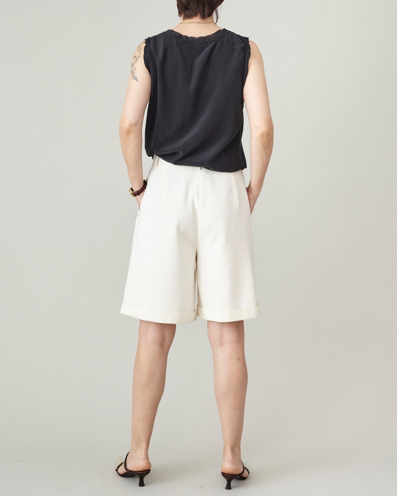Back view of handmade raw silk Bermuda shorts, tailored fit with folded hem, minimalist summer style