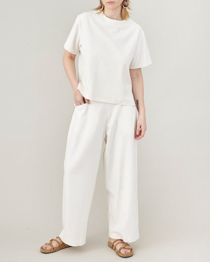 Minimalist wide-leg raw silk trousers styled for an elegant summer outfit.